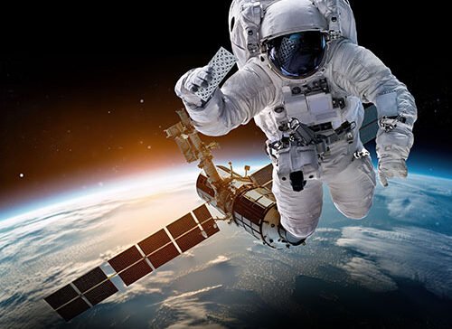 astronaut holding 3dprint product in space